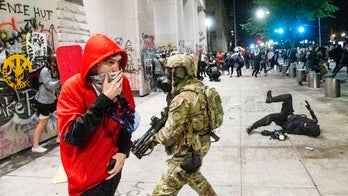 Oregon state police arrive in Portland in push to stop riots