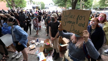 Police: Crowd smashes windows, sets fires in Seattle