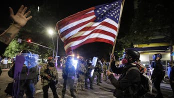 Oregon police in Portland try to quell nightly protests, riots