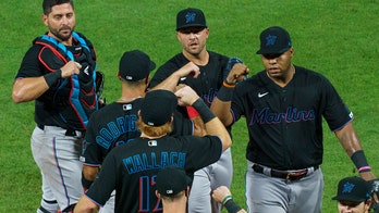 Marlins end isolation in Philly and leave for Baltimore