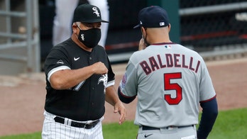 White Sox manager Renteria not with team, pending tests