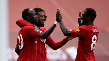 Liverpool makes triumphant Anfield return as English champ