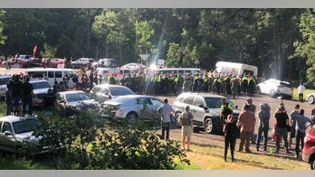 Protesters block road leading to Mount Rushmore ahead of Trump event, approximately 15 arrested