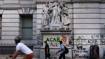 Manhattan covered in graffiti as demonstrators say NYPD budget cuts not enough