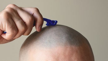 Man shaves girlfriend's head, then his own, in moving video