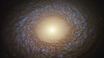 Hubble Space Telescope spots 'feathered spiral' galaxy in deep space