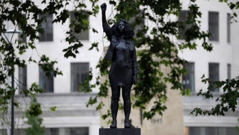 Toppled UK statue of slave trader quietly replaced with sculpture of Black Lives Matter protester