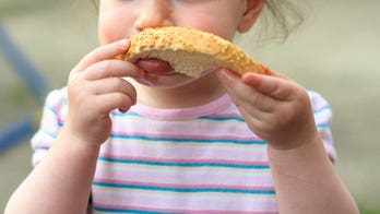 Toddler refuses to give up loaf of bread he is cuddling in adorable TikTok video