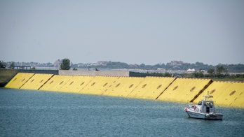 Venice finally tests Moses anti-flood system after years of reported corruption, delays