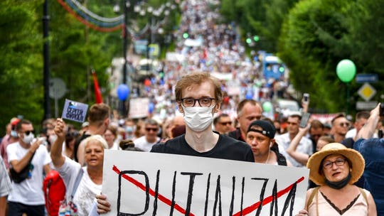 Thousands in Russia border city protest arrest of governor in challenge to Putin