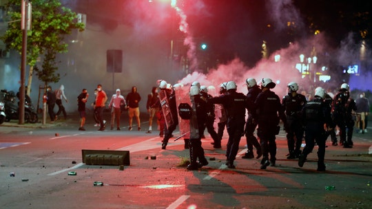 Violent clashes erupt in Serbia after new coronavirus curfew announced