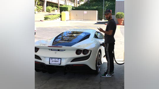 Swizz Beatz spotted filling up his new Ferrari