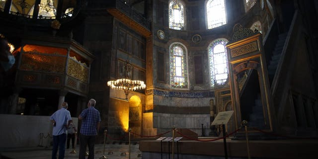 People visit the Byzantine-era Hagia Sophia, an UNESCO World Heritage site and one of Istanbul's main tourist attractions in the historic Sultanahmet district of Istanbul, Friday, July 10, 2020.