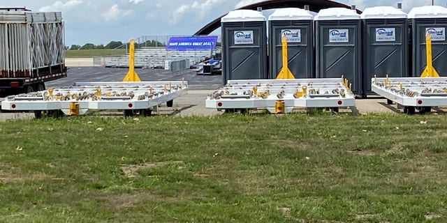 A long range view on Friday of the Trump campaign's site for Saturday night's rally with the president at Portsmouth International Airport in New Hampshire. The rally has been postponed due to severe weather concerns.