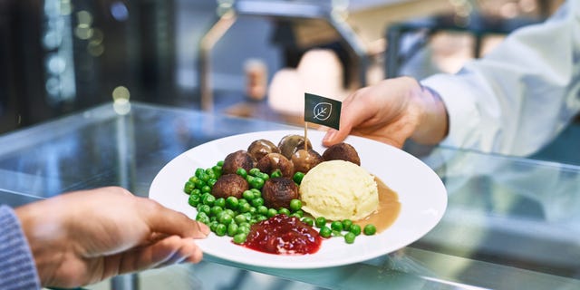 Across store restaurants, the plant balls, pictured, will be served with mashed potatoes, lingonberries and cream sauce, just like the original meat version of the dish. 