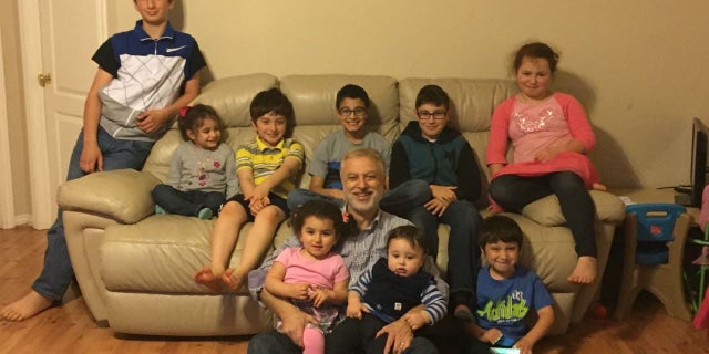 Happier times: Majd Kamalmaz with his grandchildren in the U.S.