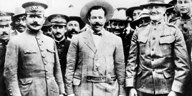 This picture, taken at the border at Nogales, Ariz., in 1916, shows, from left, Gen. Alvaro Obregon, Gen. Pancho Villa and Gen. John J. Pershing in a friendly meeting. (AP Photo)