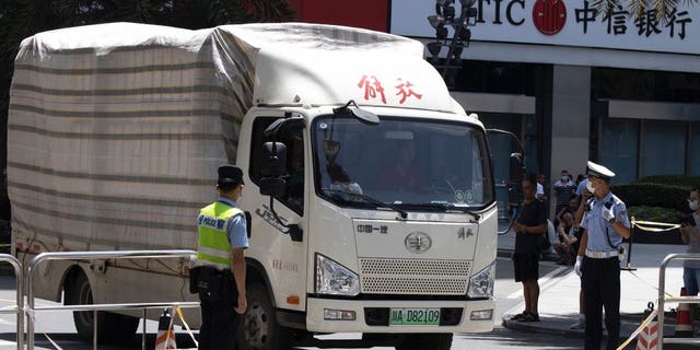 A movers' truck with the words "Liberation" on top arrives outside the United States Consulate in Chengdu in southwest China's Sichuan province on Sunday, July 26, 2020. China ordered the United States on Friday to close its consulate in the western city of Chengdu, ratcheting up a diplomatic conflict at a time when relations have sunk to their lowest level in decades.