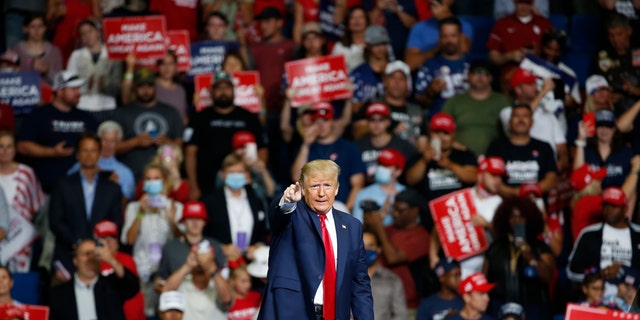 President Donald Trump speaks during a campaign rally at the BOK Center in Tulsa, Okla on June 20, 2020. The coronavirus pandemic isn't going away anytime soon, but campaigns are still forging ahead with in-person organizing. The pandemic upended elections this year, forcing campaigns to shift their organizing activities almost entirely online and compelling both parties to reconfigure their conventions. (AP Photo/Sue Ogrocki, File)