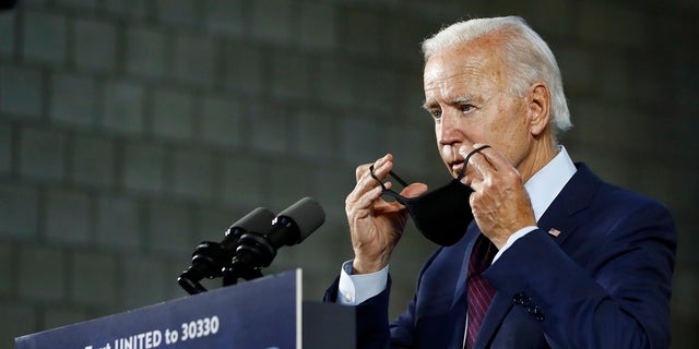 Democratic presidential candidate, former Vice President Joe Biden, puts on a face mask after speaking at an event in Lancaster, Pa. Biden said Wednesday that he would restore the same contraceptive mandate policy the Obama administration had before a 2014 Supreme Court case involving the craft store Hobby Lobby. (AP Photo/Matt Slocum)