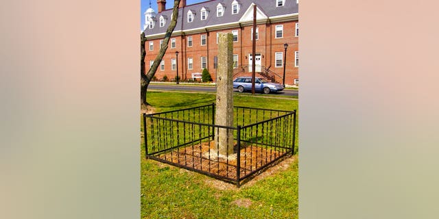 In this undated photo from the Delaware Division of Historical & Cultural Affairs, a whipping post is displayed on the grounds of the Old Sussex County Courthouse near the Circle in Georgetown, Del. (Delaware Division of Historical & Cultural Affairs via AP)