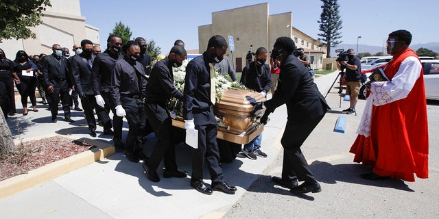 Pallbearers carry Robert Fuller's casket after his funeral Tuesday, June 30, 2020, in Littlerock, Calif. Fuller, a 24-year-old Black man, was found hanging from a tree in a park in a Southern California high desert city. Authorities initially said the death of Fuller appeared to be a suicide but protests led to further investigation, which continues. (AP Photo/Marcio Jose Sanchez)