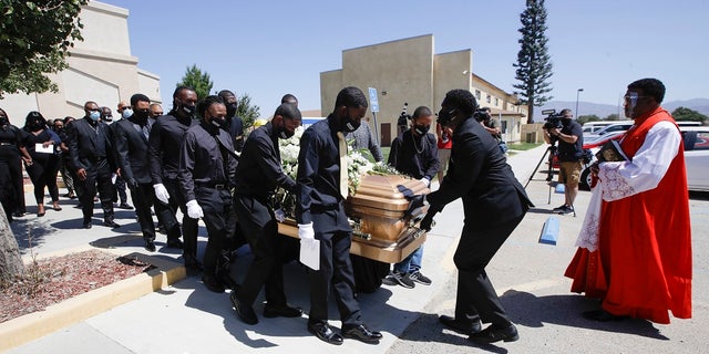 Pallbearers carry Robert Fuller's casket after his funeral Tuesday, June 30, 2020, in Littlerock, Calif. Fuller, a 24-year-old Black man, was found hanging from a tree in a park in a Southern California high desert city. Authorities initially said the death of Fuller appeared to be a suicide but protests led to further investigation, which continues. (AP Photo/Marcio Jose Sanchez)