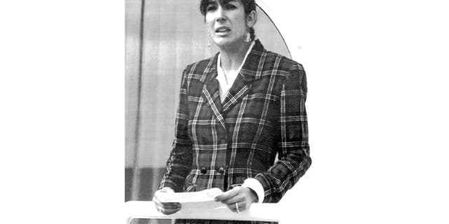 In this Nov. 7, 1991, file photo Ghislaine Maxwell, daughter of late British publisher Robert Maxwell, reads a statement in Spanish in which she expressed her family's gratitude to the Spanish authorities, aboard the "Lady Ghislaine" in Santa Cruz de Tenerife. (AP Photo/Dominique Mollard, File)
