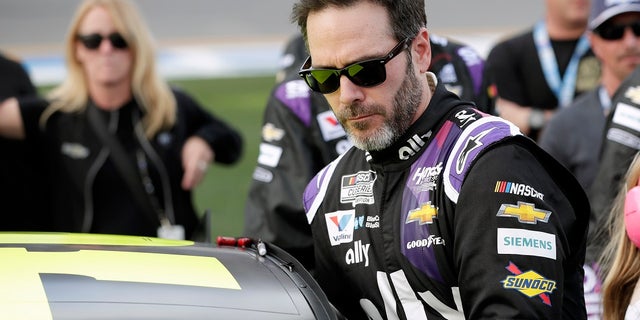 In this Feb. 16 file photo Jimmie Johnson climbs into his car before the NASCAR Daytona 500 auto race at Daytona International Speedway in Daytona Beach, Fla. (AP Photo/John Raoux, File)