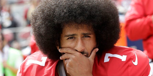 NEA teachers union promotes book about teenagers taking a knee to National Anthem 2 Former San Francisco 49ers quarterback Colin Kaepernick kneels during the national anthem before an NFL football game against the Dallas Cowboys, in Santa Clara, Calif.