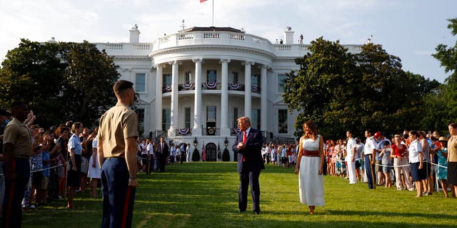 President Donald Trump and first lady Melania Trump appear at a "Salute to America" event on the South Lawn of the White House, Saturday, July 4, 2020, in Washington. (AP Photo/Patrick Semansky)