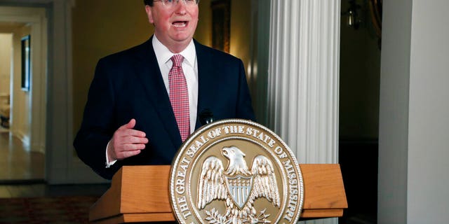 FILE: Mississippi Gov. Tate Reeves delivers a televised address prior to signing a bill retiring the last state flag in the United States with the Confederate battle emblem, during a ceremony at the Governor's Mansion in Jackson, Miss.