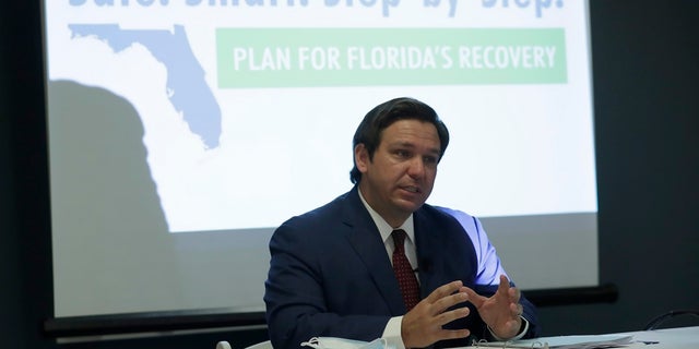 Florida Gov. Ron DeSantis speaks during a news conference at the old Pan American Hospital during the coronavirus pandemic, Tuesday in Miami. More than 40 intensive care units across the state have reached full capacity, according to government data released Tuesday. (AP Photo/Lynne Sladky)