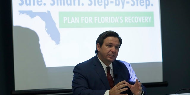 Florida Gov. Ron DeSantis speaks during a news conference at the old Pan American Hospital during the coronavirus pandemic, Tuesday in Miami. More than 40 intensive care units across the state have reached full capacity, according to government data released Tuesday. (AP Photo/Lynne Sladky)