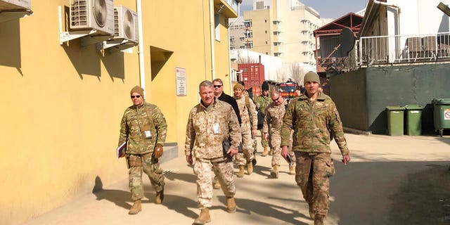 In this Jan. 31, 2020, file photo Marine Gen. Frank McKenzie, center, top U.S. commander for the Middle East, makes an unannounced visit in Kabul, Afghanistan. (AP Photos/Lolita Baldor, File)