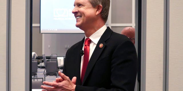 In this Feb. 1, 2020 file photo, U.S. Rep. Roger Marshall, R-Kan., a candidate for the U.S. Senate, awaits the start of a debate in Olathe, Kansas. Establishment Republicans who'd been coy for months about the GOP primary for Kansas' open Senate seat are increasingly putting their thumbs on the scale. They're hoping to push western Kansas Rep. Roger Marshall to victory over polarizing conservative Kris Kobach. (AP Photo/John Hanna, File)