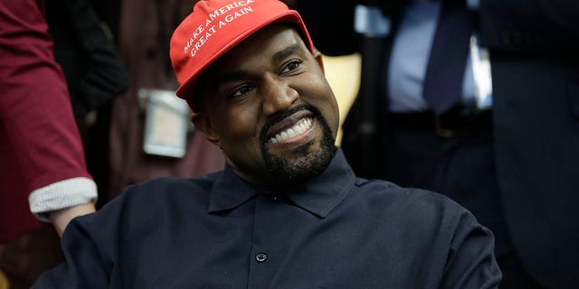 FILE - Rapper Kanye West wears a Make America Great again hat during a meeting with President Donald Trump in the Oval Office of the White House in Washington on Oct. 11, 2018. West says he is no longer a Trump supporter. The rapper, who once praised Trump, tells Forbes in a story published July 8, 2020, that he is “taking the red hat off” — a reference to Trump’s trademark red “Make America Great Again” cap. West also insisted that his announcement that he’s running for President was not a stunt to drum up interest in an upcoming album. (AP Photo/Evan Vucci, File)