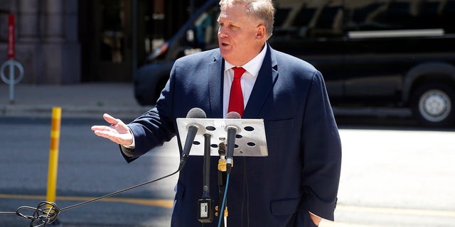 Attorney Ron Meuser, Jr. addresses a news conference across from Minneapolis City Hall on Friday where he discussed the alarming rate of Minneapolis Police Officers who are filing claims for Post-Traumatic Stress Disorder (PTSD). He said In the last six weeks, over 150 police officers have started the process of filing physical and mental disability claims, the majority of which encompass officers suffering from PTSD. (AP Photo/Jim Mone)