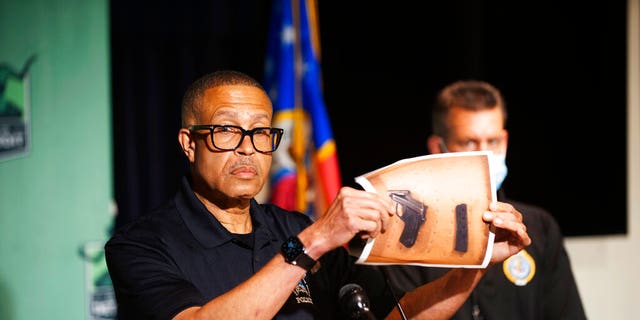 Detroit Police Chief James Craig shows a photograph of the handgun used by a Hakeem Littleton, who shot at police officers at close range while they were arresting his friend in Detroit. Officers returned fire and killed Littleton.