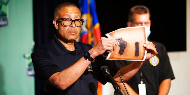 Detroit Police Chief James Craig shows a photograph of the handgun used by a Hakeem Littleton, who shot at police officers at close range while they were arresting his friend in Detroit. Officers returned fire and killed Littleton.