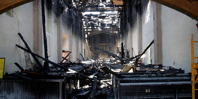 The interior of the San Gabriel Mission is damaged following a morning fire, Saturday, July 11, 2020, in San Gabriel, Calif. The fire destroyed the rooftop and most of the interior of the nearly 250-year-old California church that was undergoing renovation. (AP Photo/Marcio Jose Sanchez)