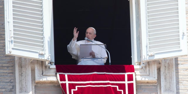 Pope Francis delivers his blessing to faithful during the Angelus prayer from the window of his studio overlooking St. Peter's Square at the Vatican, Sunday, July 12, 2020. (AP Photo/Alessandra Tarantino)