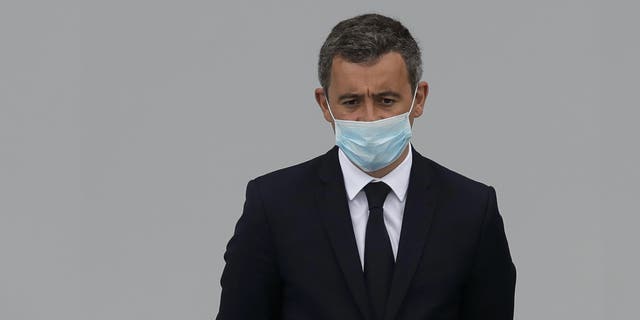 France's Interior Minister Gerald Darmanin attends the Bastille Day military parade, Tuesday, July 14, 2020 in Paris. France are honoring nurses, ambulance drivers, supermarket cashiers and others on its biggest national holiday Tuesday. Bastille Day's usual grandiose military parade in Paris is being redesigned this year to celebrate heroes of the coronavirus pandemic. (AP Photo/Christophe Ena, Pool)