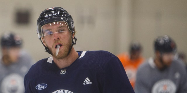 Edmonton Oilers' Connor McDavid (97) takes part in NHL hockey training camp in Edmonton, Alta., on Tuesday July 14, 2020. (Jason Franson/The Canadian Press via AP)