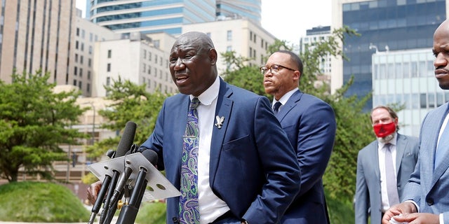 Attorney Ben Crump speaks during a news conference Wednesday in Minneapolis accompanied by co-counsel members, announcing a civil lawsuit against the city of Minneapolis and the officers involved in the death of George Floyd on Memorial Day. (AP Photo/Jim Mone)