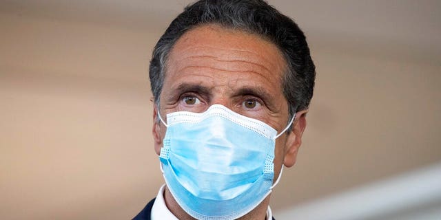 New York Gov. Andrew Cuomo wears a mask during a news conference at Laguardia Airport's Terminal B, in New York on June 10, 2020. (AP Photo/Mark Lennihan, FIle)