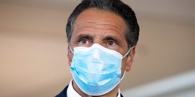 New York Gov. Andrew Cuomo wears a mask during a news conference at Laguardia Airport's Terminal B, in New York on June 10, 2020. (AP Photo/Mark Lennihan, FIle)