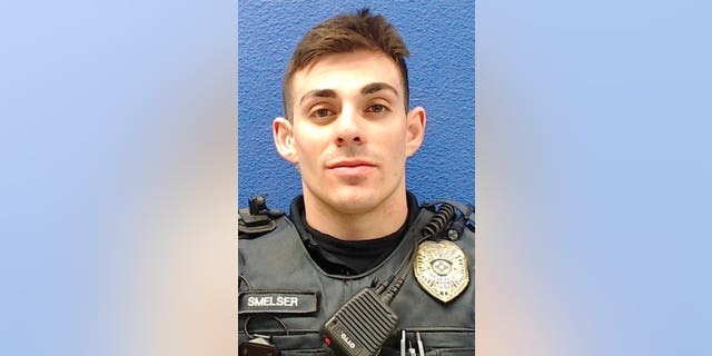 This undated photo provided by the Las Cruces Police Department shows former officer Christopher Smelser, who has been charged with second-degree murder after authorities say he killed a detainee he had placed in a chokehold. (Las Cruces Police Department via AP)