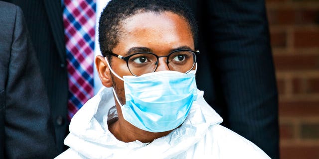 Tyrese Haspil, 21, being escorted out of the 7th precinct by NYPD detectives this past Friday. 