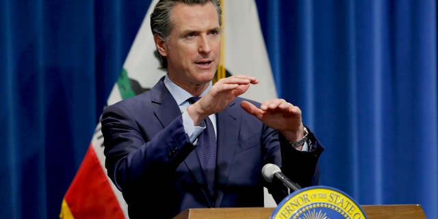 In this May 14, 2020, file photo, California Gov. Gavin Newsom discusses his revised 2020-2021 state budget during a news conference in Sacramento, Calif. Gov. Gavin Newsom announced Friday, July 17, 2020, that most counties will start the school year online due to soaring coronavirus cases and hospitalizations, but counties that have seen little of the virus, mostly towns and rural communities in California's north and east can bring students and teachers back to campus. (AP Photo/Rich Pedroncelli, Pool, File)